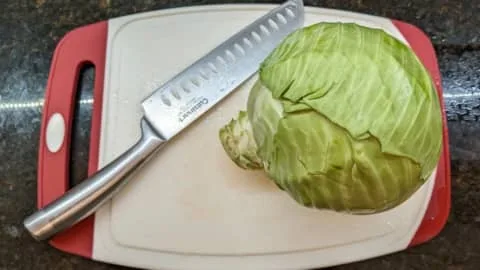 how to cut a cabbage on a cutting boardhow to cut a cabbage on a cutting board