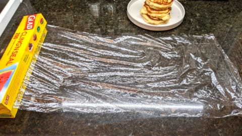 how to store cooked pancakes in plastic wrap starting with pulling out a long sheet