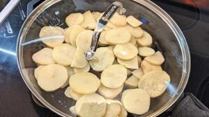 initial covered cooking of pan fried potato slices recipe