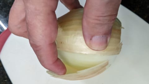 Lift away both sides of the slit onion skin lift away both sides of the slit onion skin