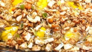 lightly mixing in eggs to asian chicken rice casserole