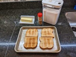 lightly toasted slices on baking sheet for cinnamon toast recipe