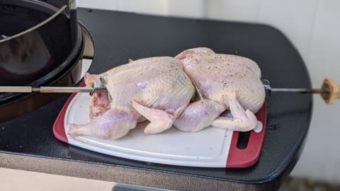 load up rotisserie spit with meat