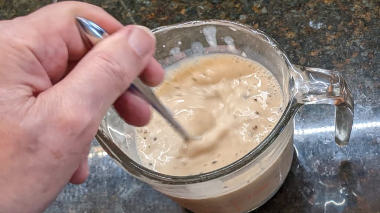mixing cream of mushroom soup and milk for french bean casserole