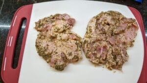 marinated pork chops ready for layering in pan fried cuban stuffed pork chops recipe