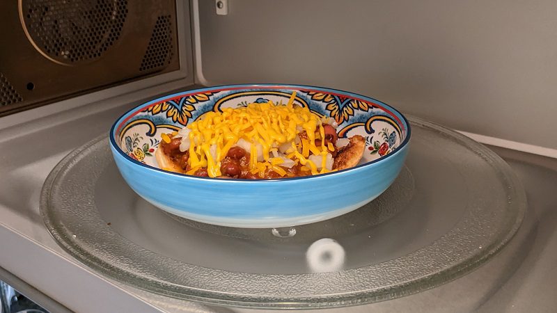 melting the cheese on a chili dog in the microwave