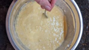 mix in wet ingredients to make batter for cornbread loaf pan recipe