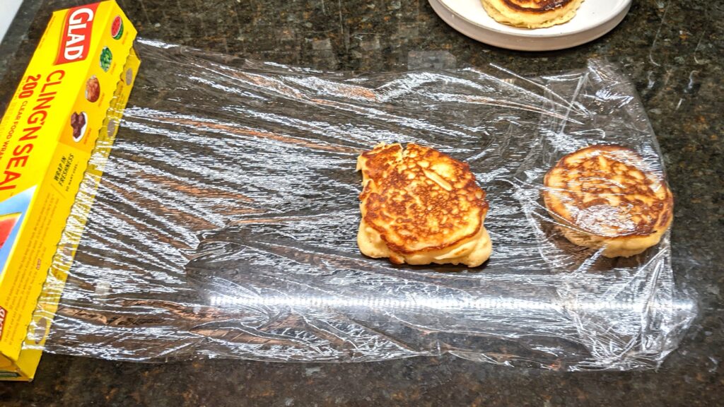 placing 2nd pancake with gap for covering in plastic wrap for storage