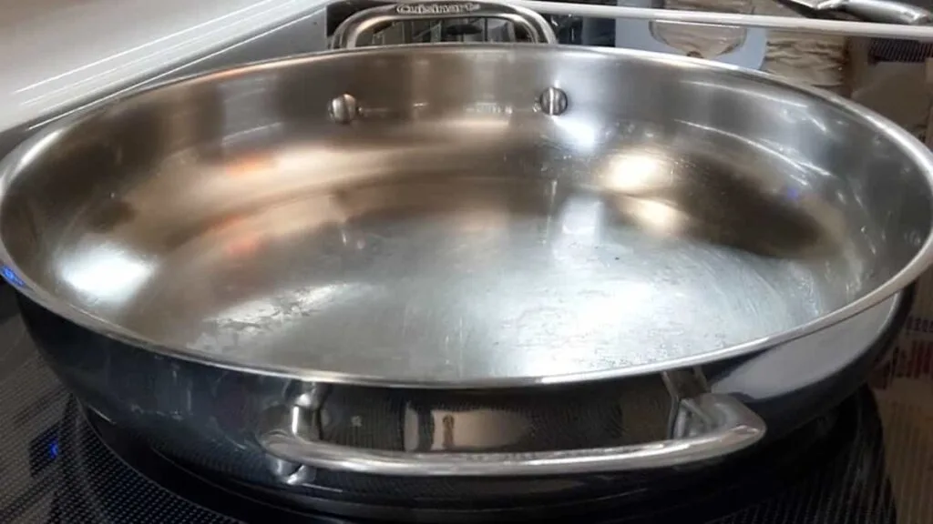 preheating fry pan for scrambled eggs in stainless steel