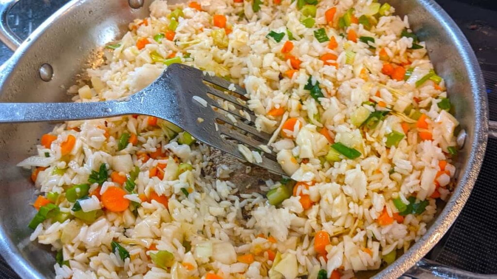 prep step stir fry veggies rice mixture for asian chicken rice casserole