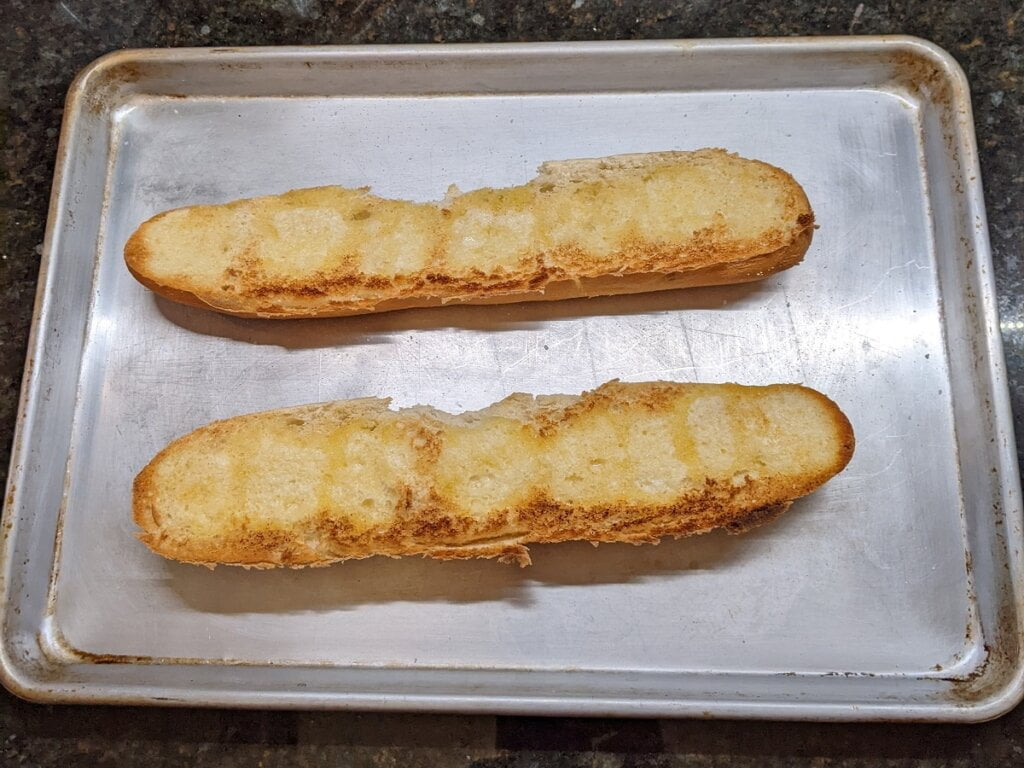 Broiled bread halves for open faced kielbasa sandwich