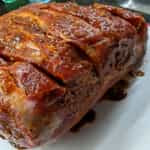 prepared-roast-for-pulled-pork-on-a-charcoal-grill-with-rub-applied-1