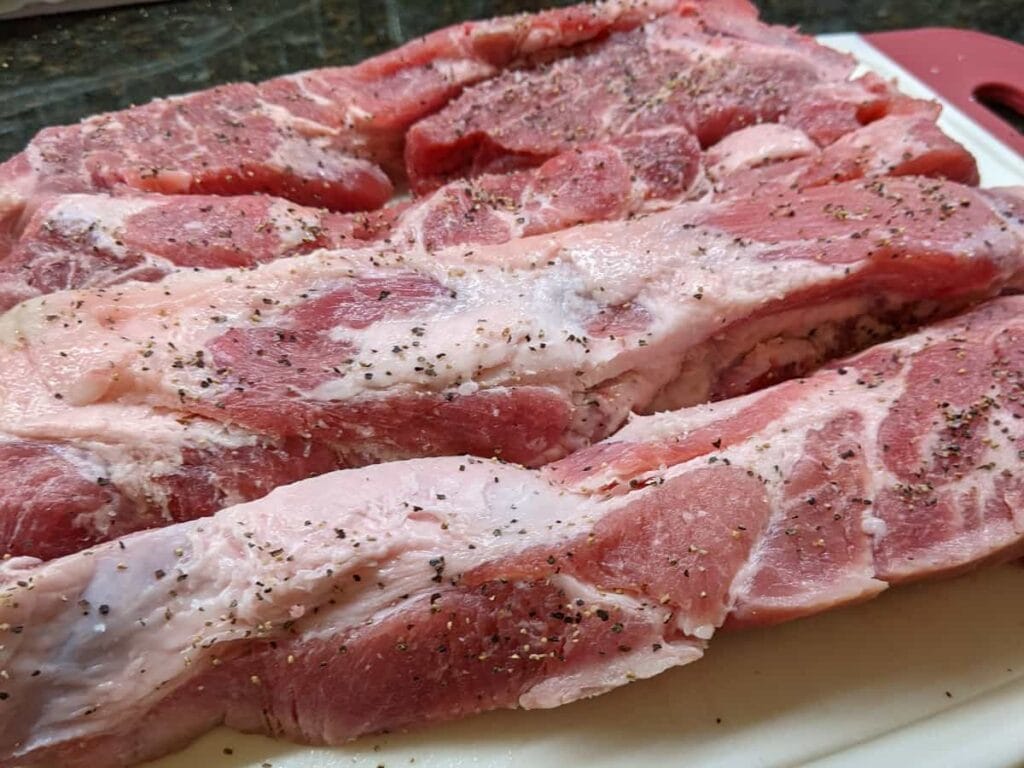 preparing ribs by applying rub individually