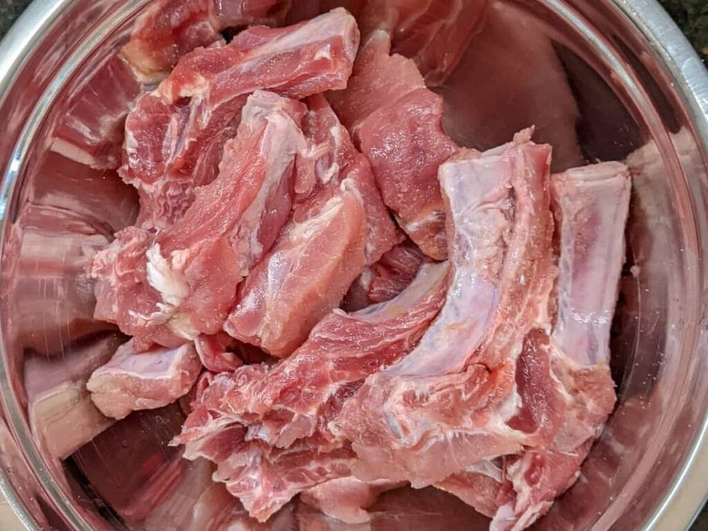 preparing ribs to apply spices rub in bowl