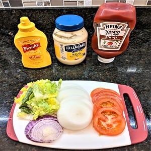 prepped popular toppings and condiments for grilling hamburgers and hot dogs together prepped popular toppings and condiments for grilling hamburgers and hot dogs together