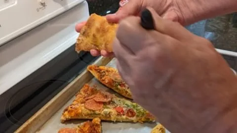 prepping to reheat homemade oven baked pizza slices in oven