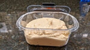 ready to store garbanzo dip for later having naan bread and hummus