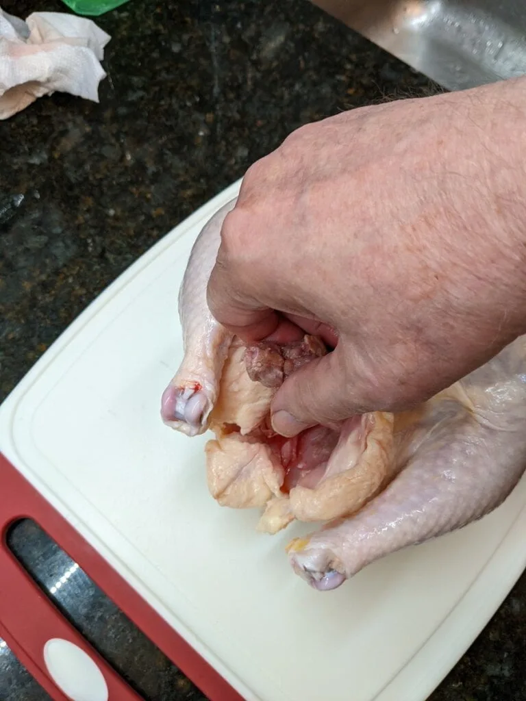 Remove chicken innards remove chicken innards