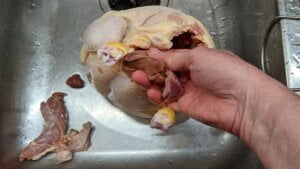 remove innards and packets from chicken