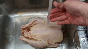 remove outer covering and rinse chicken