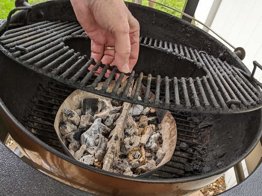 remove the weber top grilling grate to clear out any obstructions from bottom charcoal grate