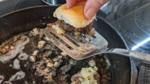 removing burgers from skillet for homemade hamburger sliders recipe