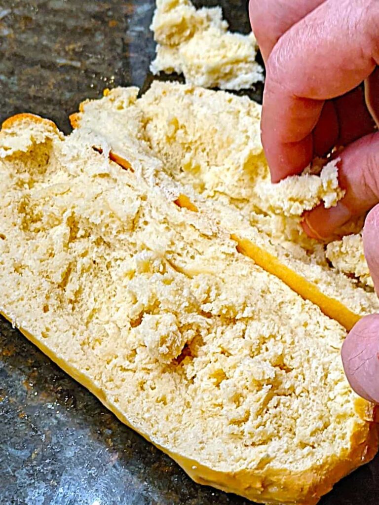 removing excess bread for recipe for chicken salad submarine sandwich