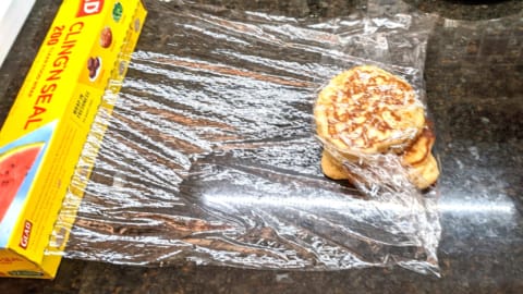 repeating with remaining pancakes for storing in plastic wrap