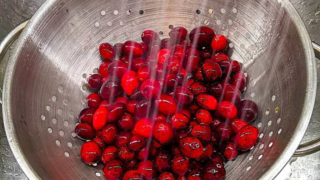 rinsing cranberries to make whole berry cranberry sauce