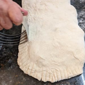 sealing a calzone with a pastry blender sealing a calzone with a pastry blender