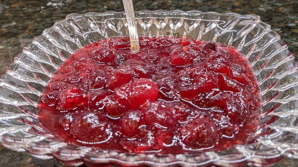 serving freshly homemade whole berry cranberry sauce