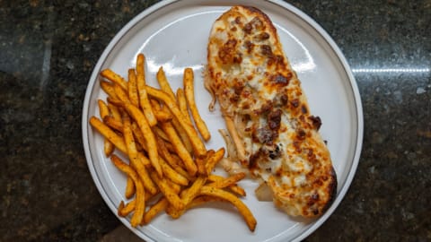 serving up darn good open face steak sandwich with fries