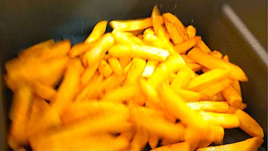 shaking fries in air fryer basket