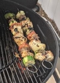 shish kabobs on charcoal grill on direct heat small