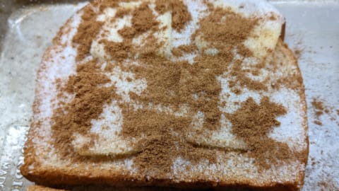 sprinkle cinnamon over sugared slices as next step for making cinnamon toast in oven sprinkle cinnamon over sugared slices as next step for making cinnamon toast in oven
