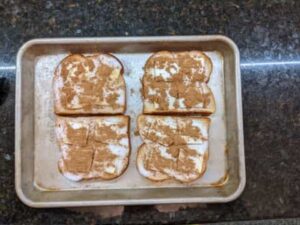 sprinkled cinnamon on slices for cinnamon toast recipe