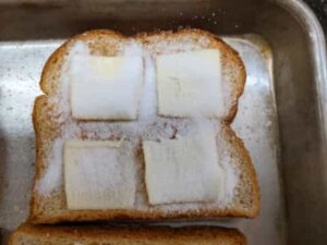 sprinkled sugar on slice for cinnamon toast recipe