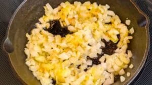 start to saute diced onions in butter for burger sliders recipe