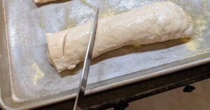 step of cutting slits in french bread dough