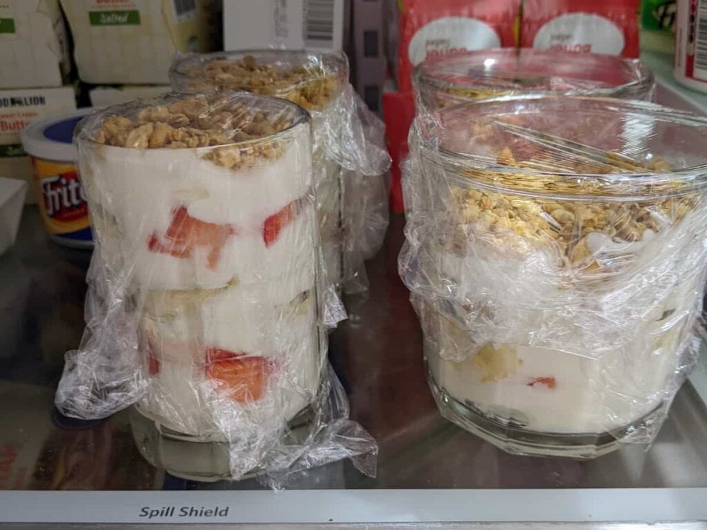 Storing strawberry yogurt granola parfaits in fridge