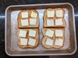 thin butter slices added to each bread for cinnamon toast