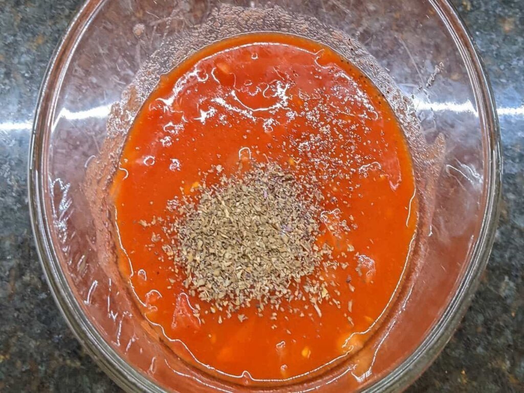 adding v8 tomato soup recipe ingredients in bowl