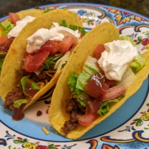 Top-off-with-sour-cream-sauce-medium top off with remaining toppings like sour cream