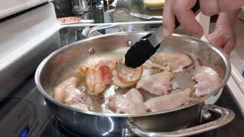 turn over each piece until both sides of bacon are cooked in the pan