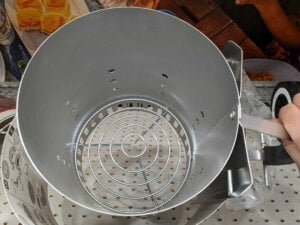 Weber charcoal chimney starter top view