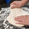 Working the handmade pizza dough